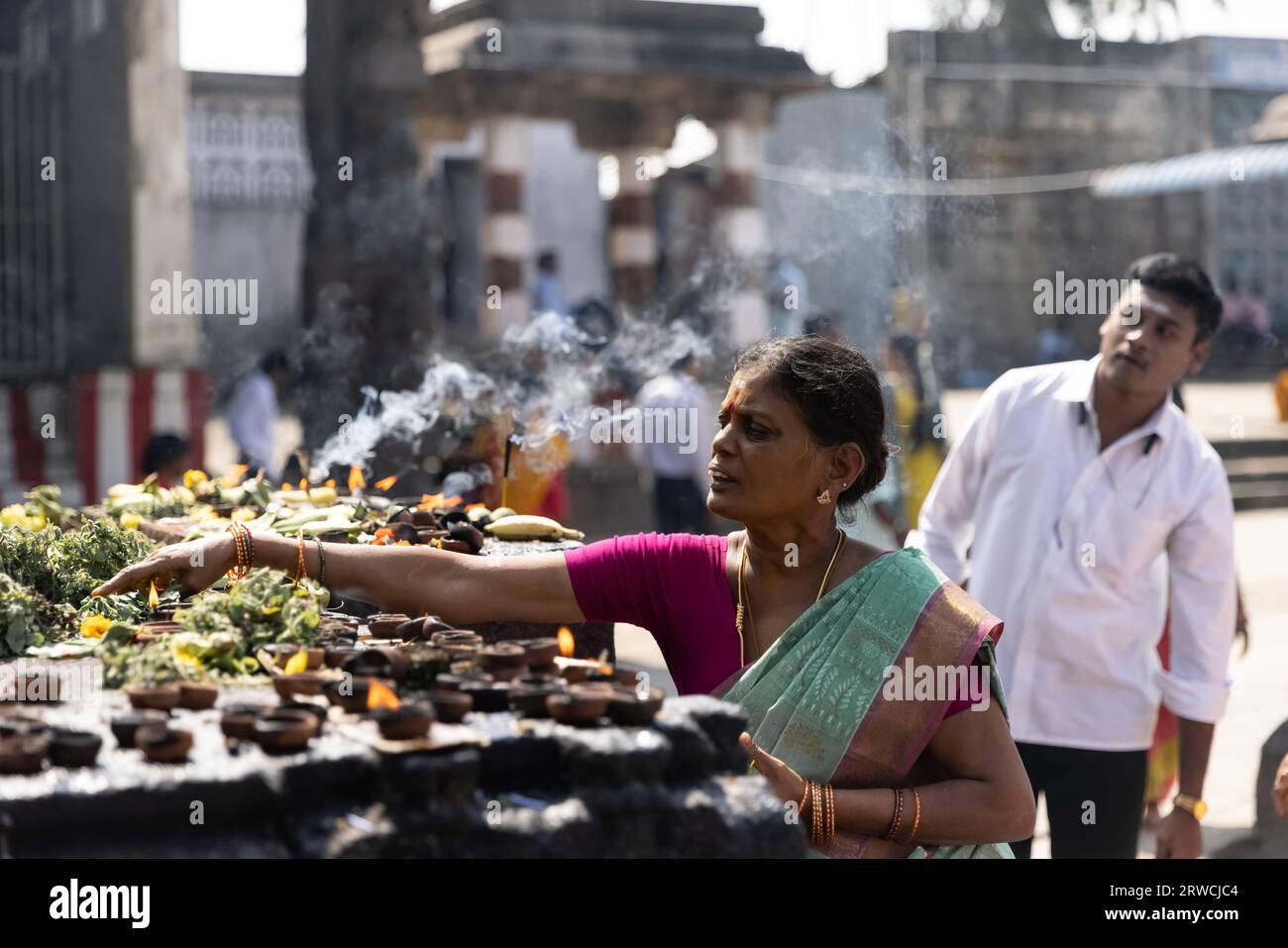 January 11, 2023, in South India, pilgrims visit an ancient Hindu temple during the night. High quality photo Stock Photo