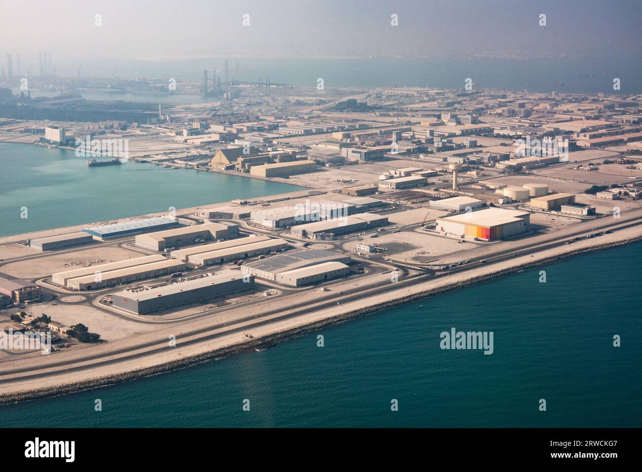 industrial warehouses and storage built on an artificial island in Bahrain Stock Photo