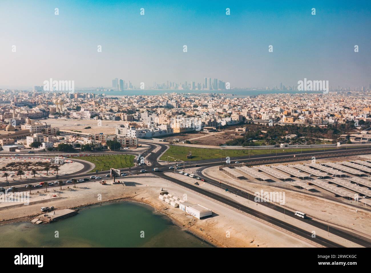 an aerial view of the township of Muharraq, near Bahrain International Airport. Manama city can be seen in the distance across the bay Stock Photo