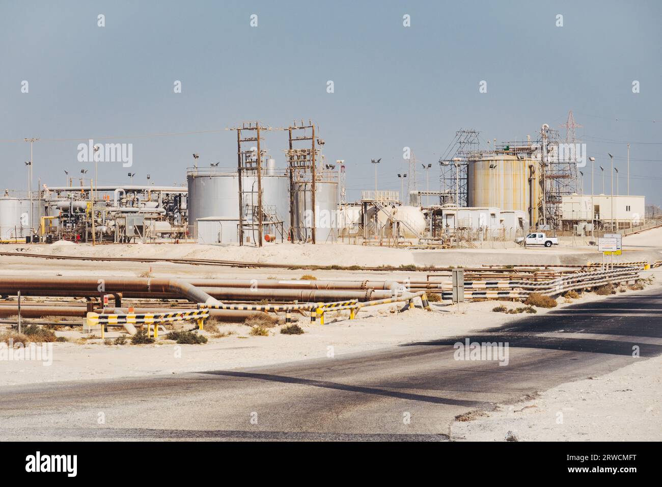 natural gas pipelines, storage tanks and other infrastructure in the desert in Bahrain Stock