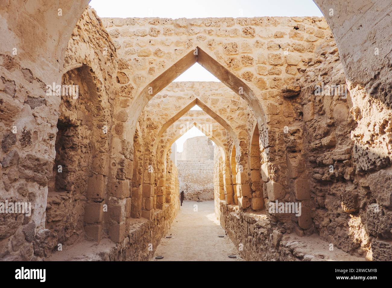 stone archways in Qal'at al-Bahrain, a fort dating back to 2300 BCE, abandoned by the Portuguese in the 16th century, in Bahrain Stock Photo
