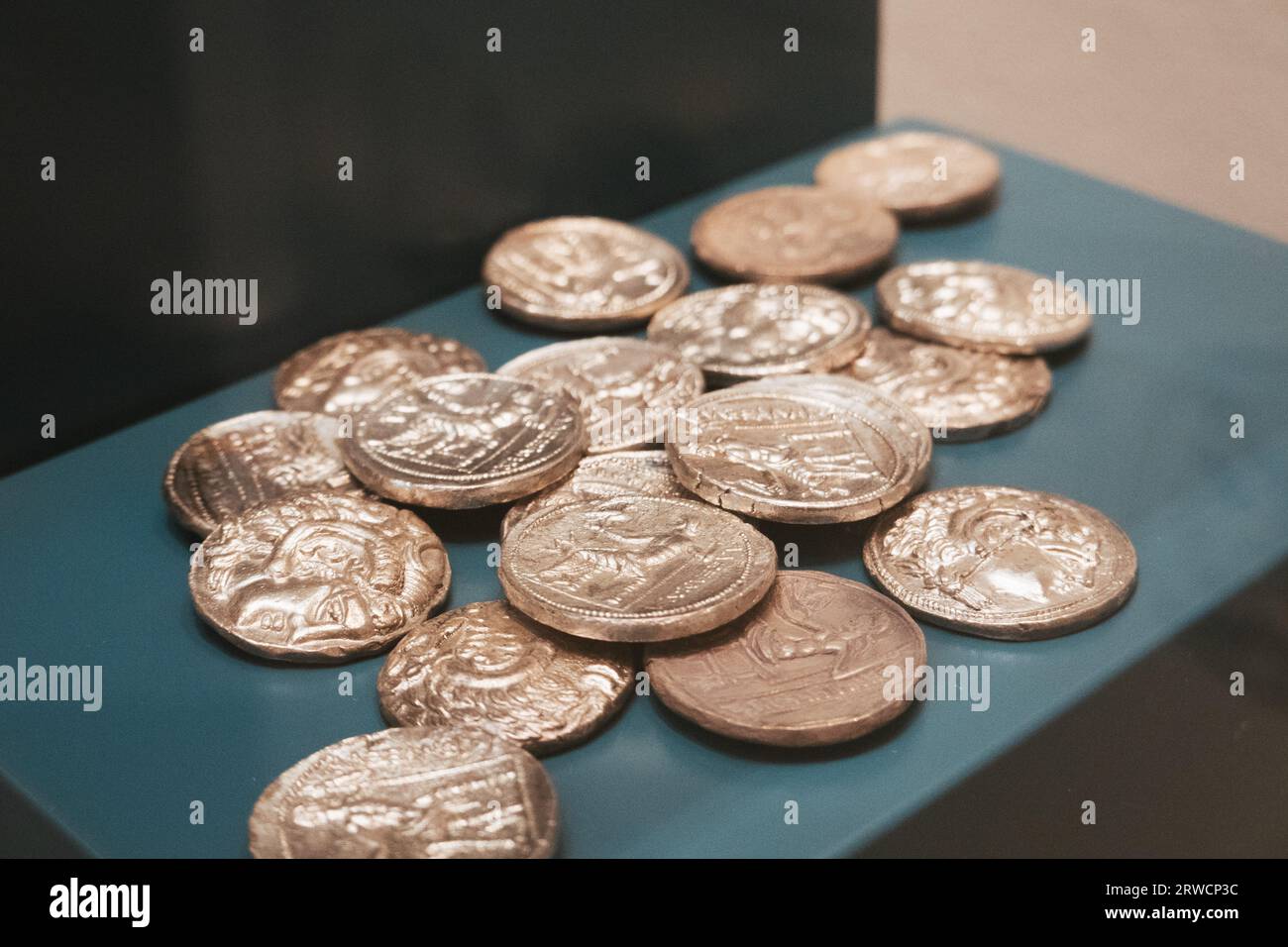 ancient coins on display at the Bahrain Fort Museum, Manama, Bahrain Stock Photo