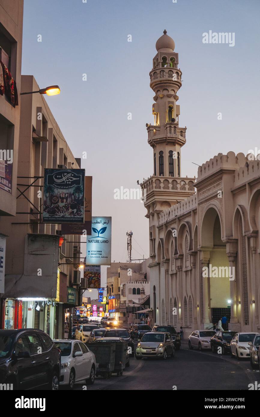 a street with a mosque on the island of Muharraq, an historic fishing town near the capital city of Manama, Bahrain Stock Photo