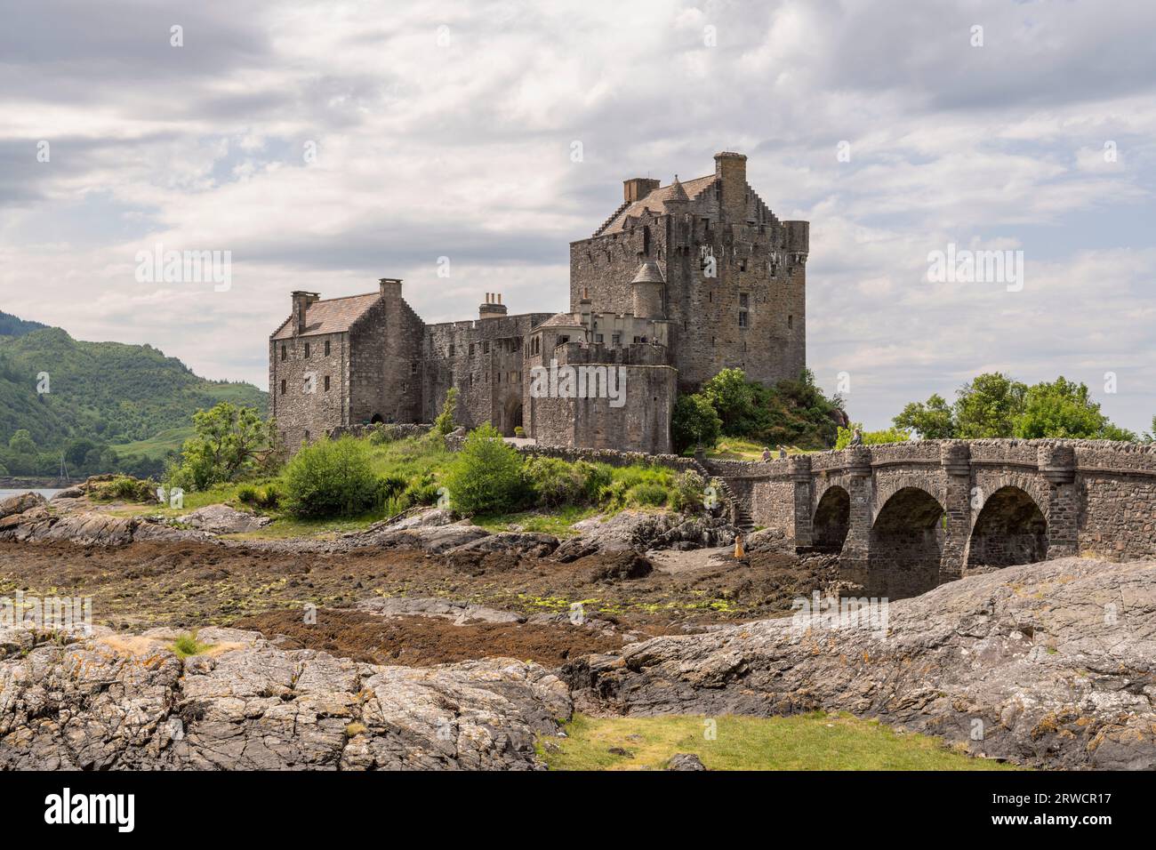 Eilean Donan Castle on the West Coast of Scotland at Low Tide in Summer Stock Photo