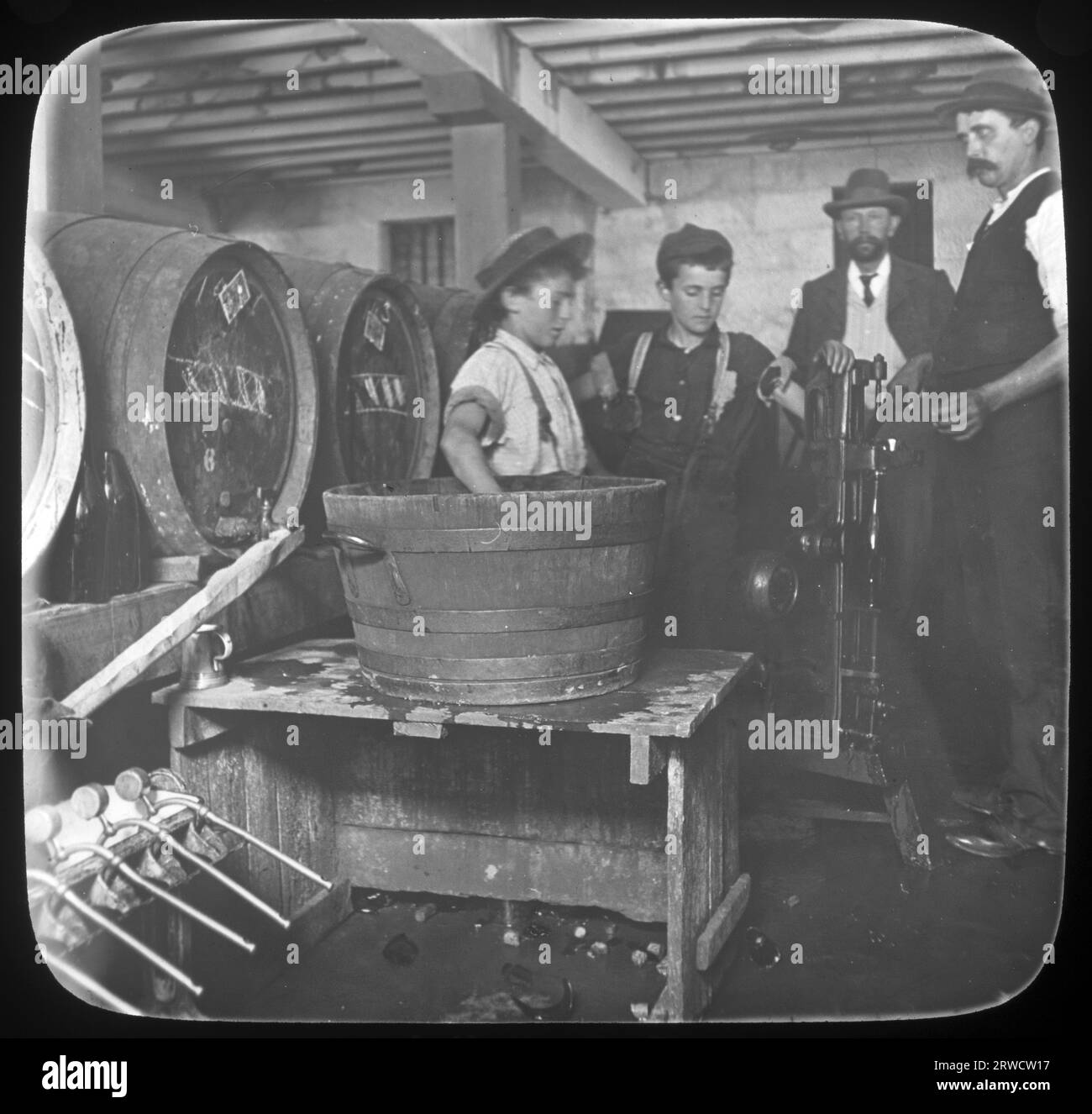 Men and boys working in the Bottling Room, Cascade Brewery Hobart, Tasmania, Australia, by