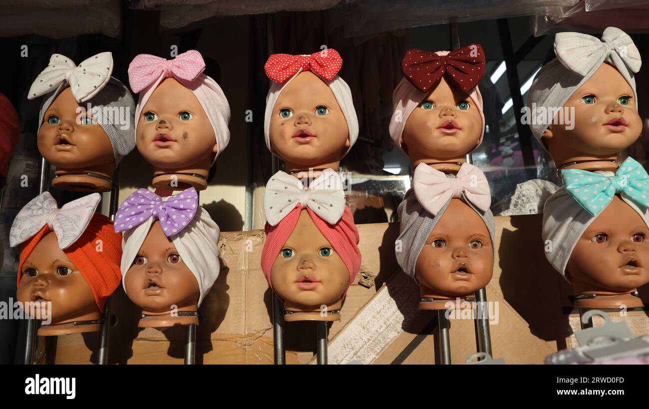 Baby faced dolls with ribbons for sale in the Sultanahmet district of Istanbul Stock Photo