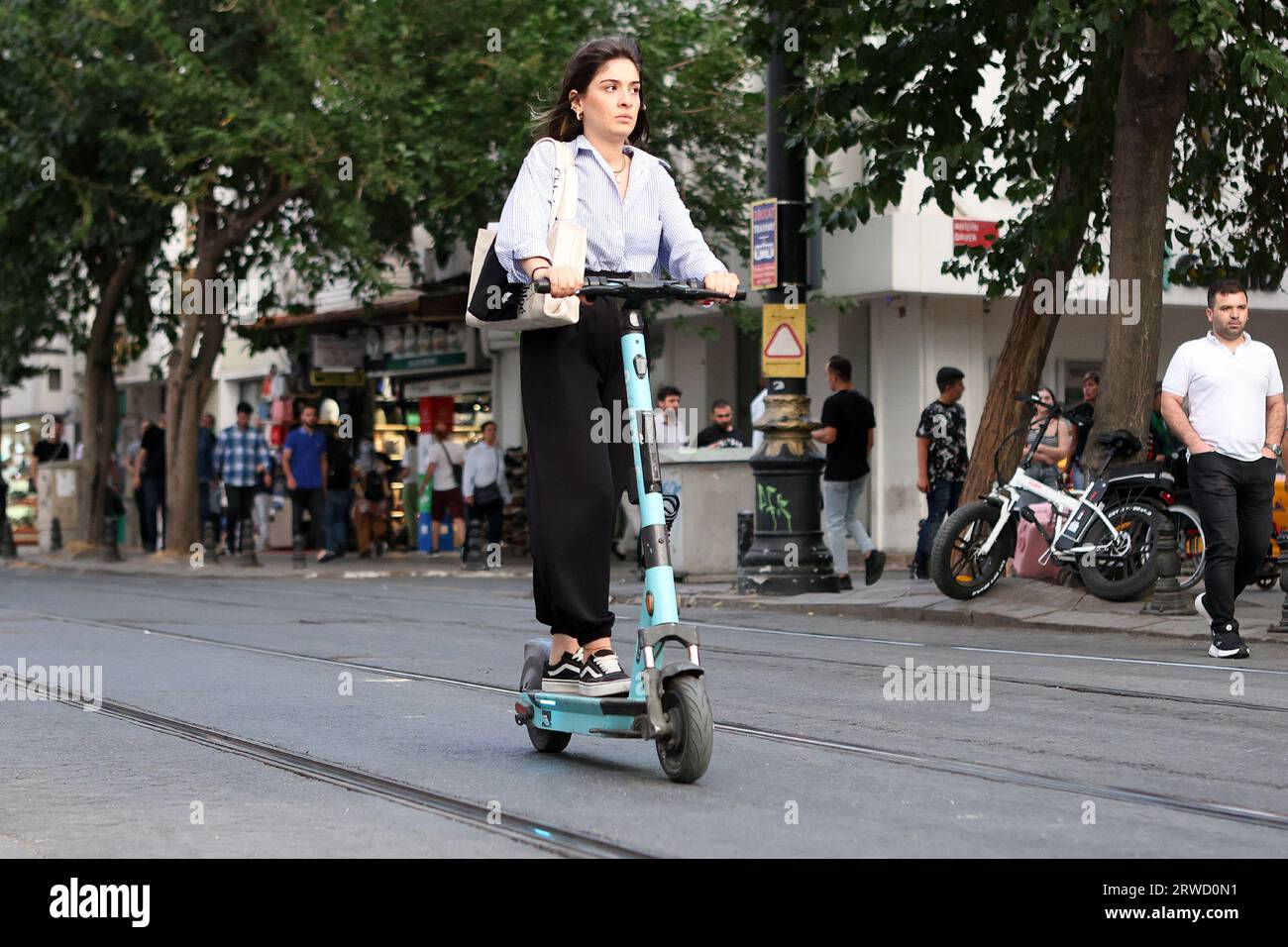 A young woman on an e-scooter in  Istanbul, Turkey Stock Photo