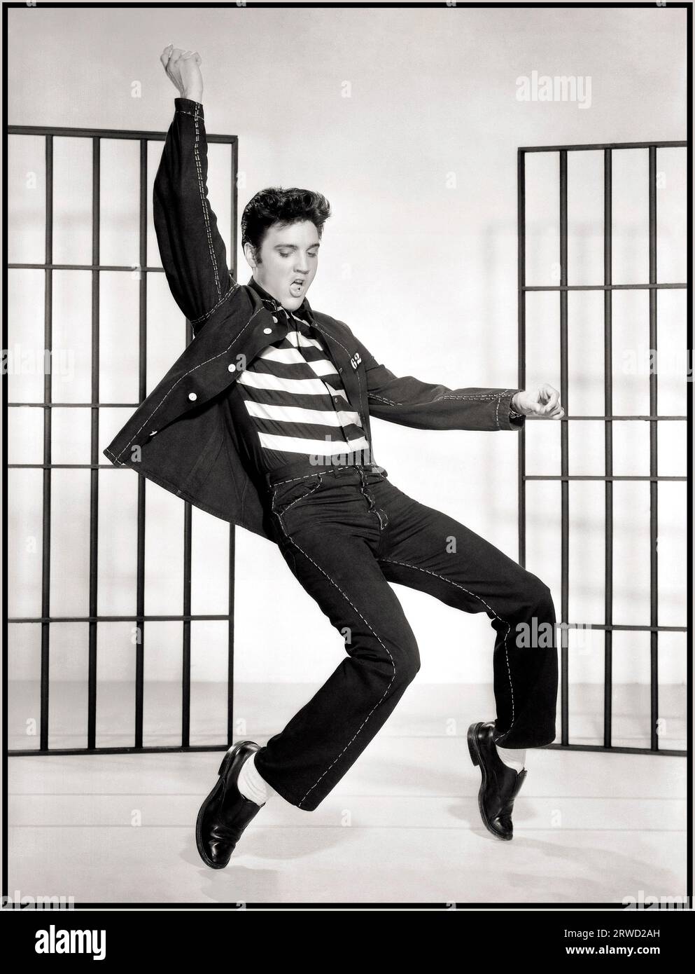 JAILHOUSE ROCK 1950's Elvis Presley film still from the iconic seminal Movie & Song 'Jailhouse Rock' 1957 The song lyrics start... 'Warden threw a party in the county Jail' Hollywood USA Stock Photo