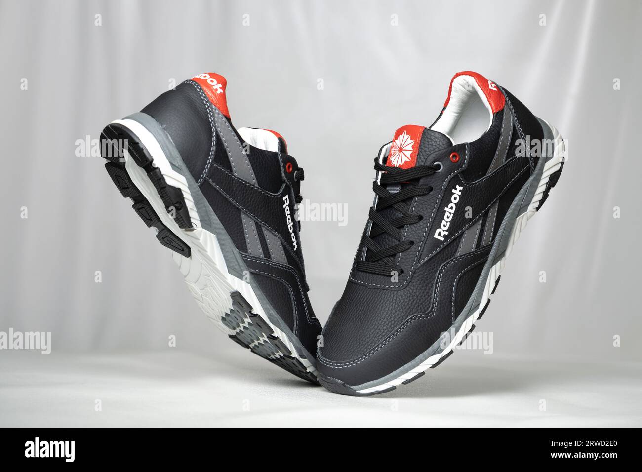 Kyiv, Ukraine - September 5, 2023: Reebok gray sneakers isolated on black  background Stock Photo - Alamy