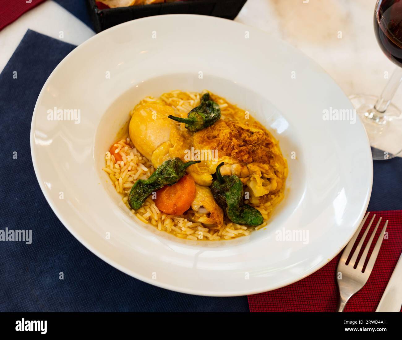 Traditional French cuisine, chicken thigh curry with rice Stock Photo