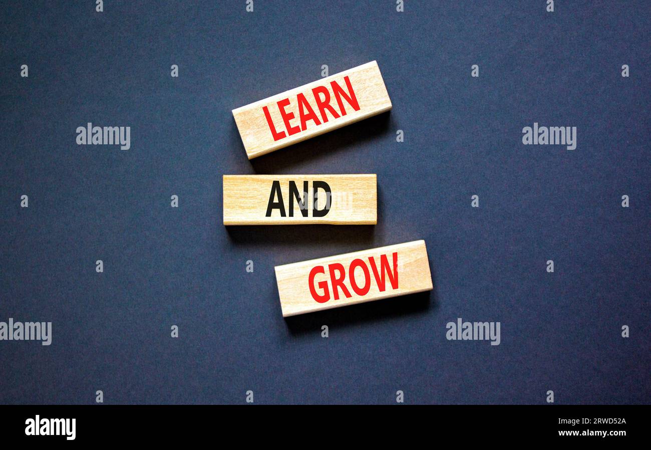 Learn and grow symbol. Concept word Learn And Grow on beautiful wooden ...