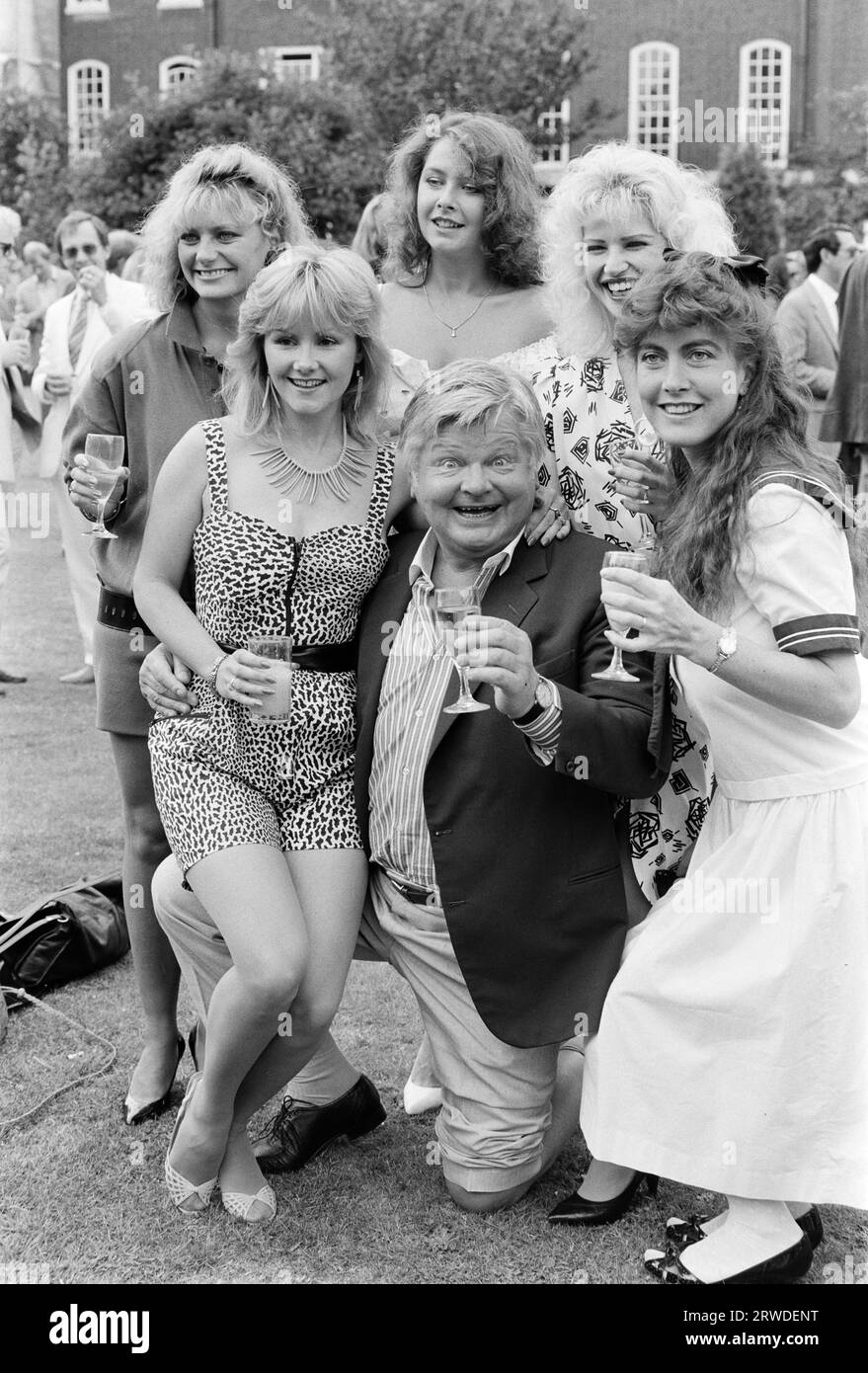 LONDON, UK. September 01, 1986: Comedian Benny Hill with his Hill’s Angels at the Thames TV Garden Party in London.  File photo © Paul Smith/Featureflash Stock Photo