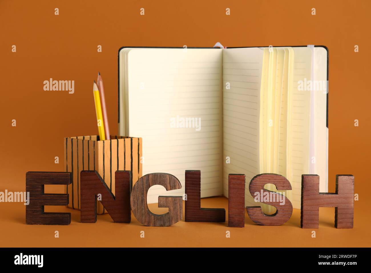 Stationery with word ENGLISH on orange background Stock Photo