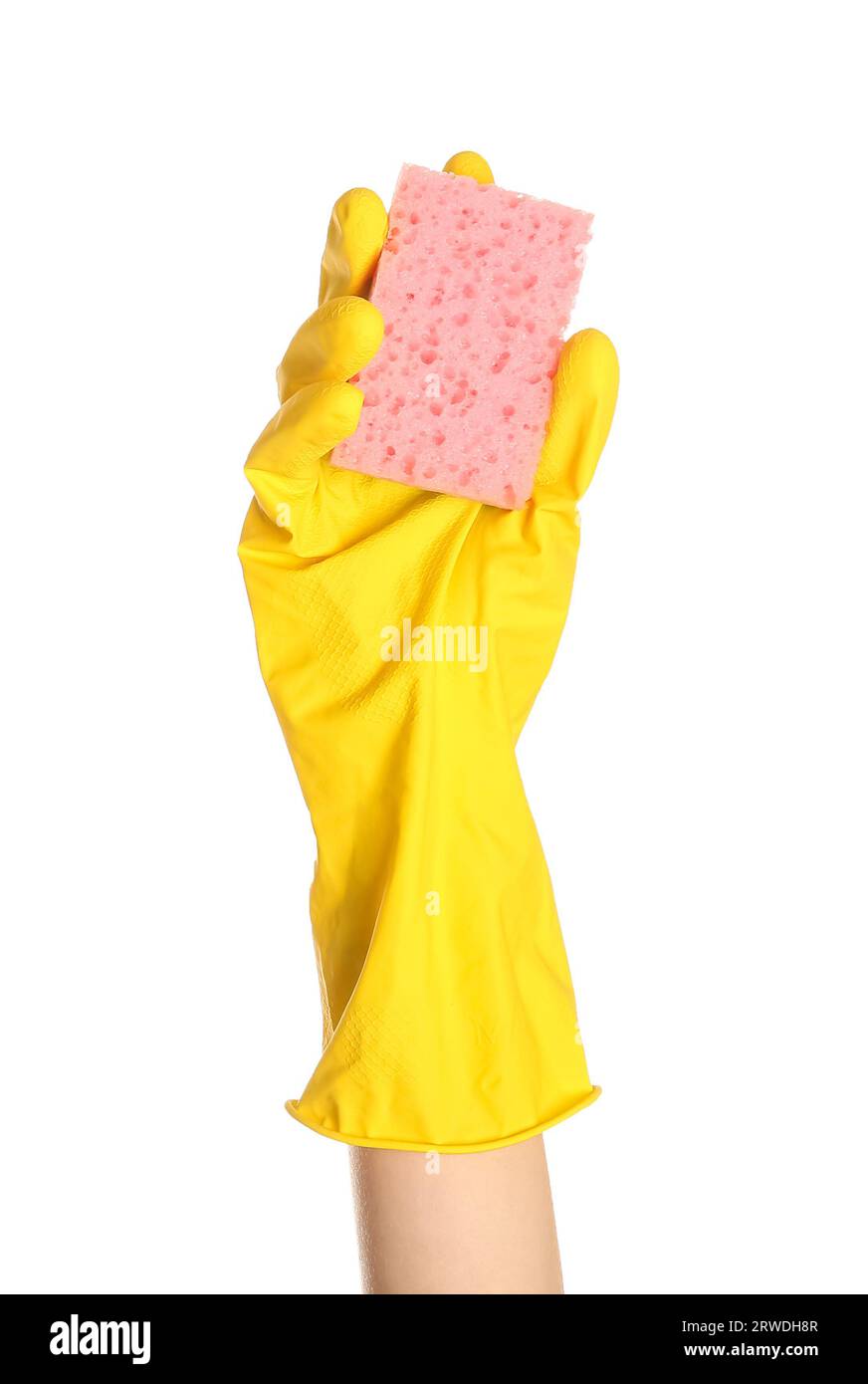 Female hand in yellow rubber glove holding sponge on white background ...