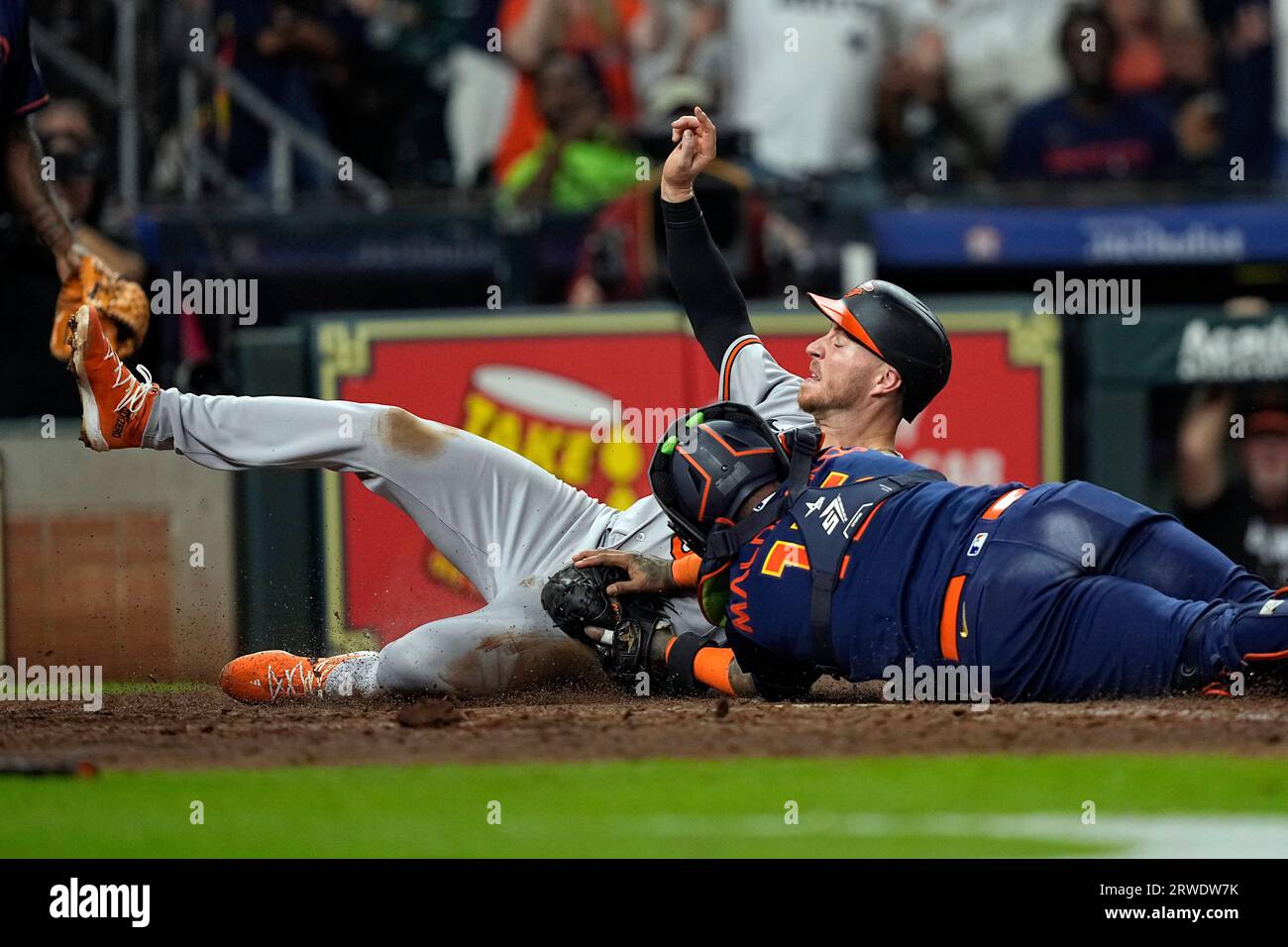 Baltimore Orioles' Ryan O'Hearn, rear, is tagged out at home plate by ...