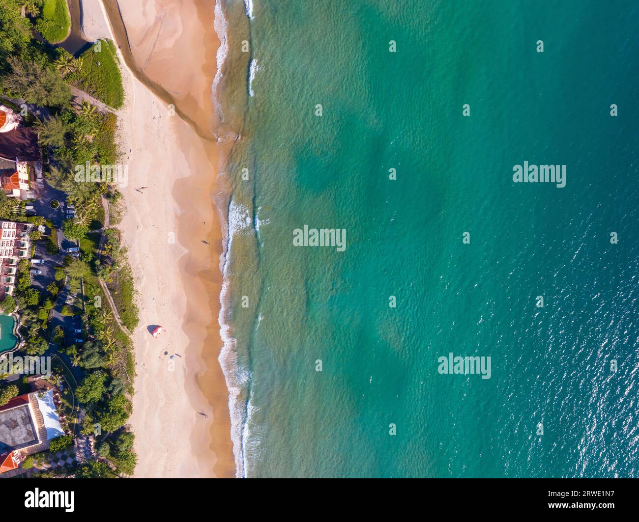 Aerial view of cars with road along the beach at Phuket island Thailand, Beautiful beach sea in summer season,Amazing light sunset or sunrise,Nature a Stock Photo