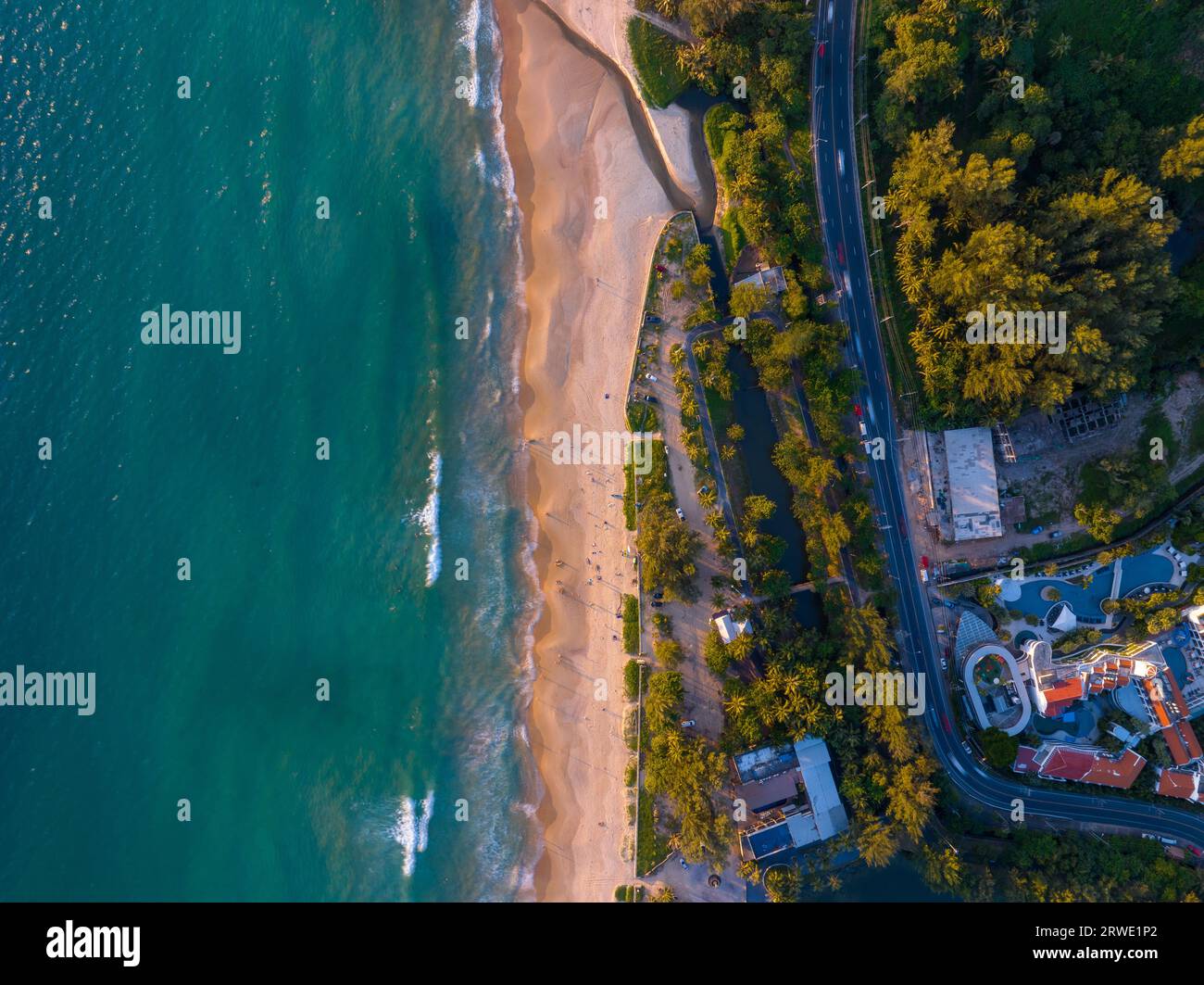 Aerial view of cars with road along the beach at Phuket island Thailand, Beautiful beach sea in summer season,Amazing light sunset or sunrise,Nature a Stock Photo