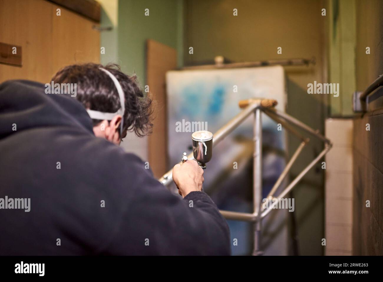 Young man spray painting hi-res stock photography and images - Alamy