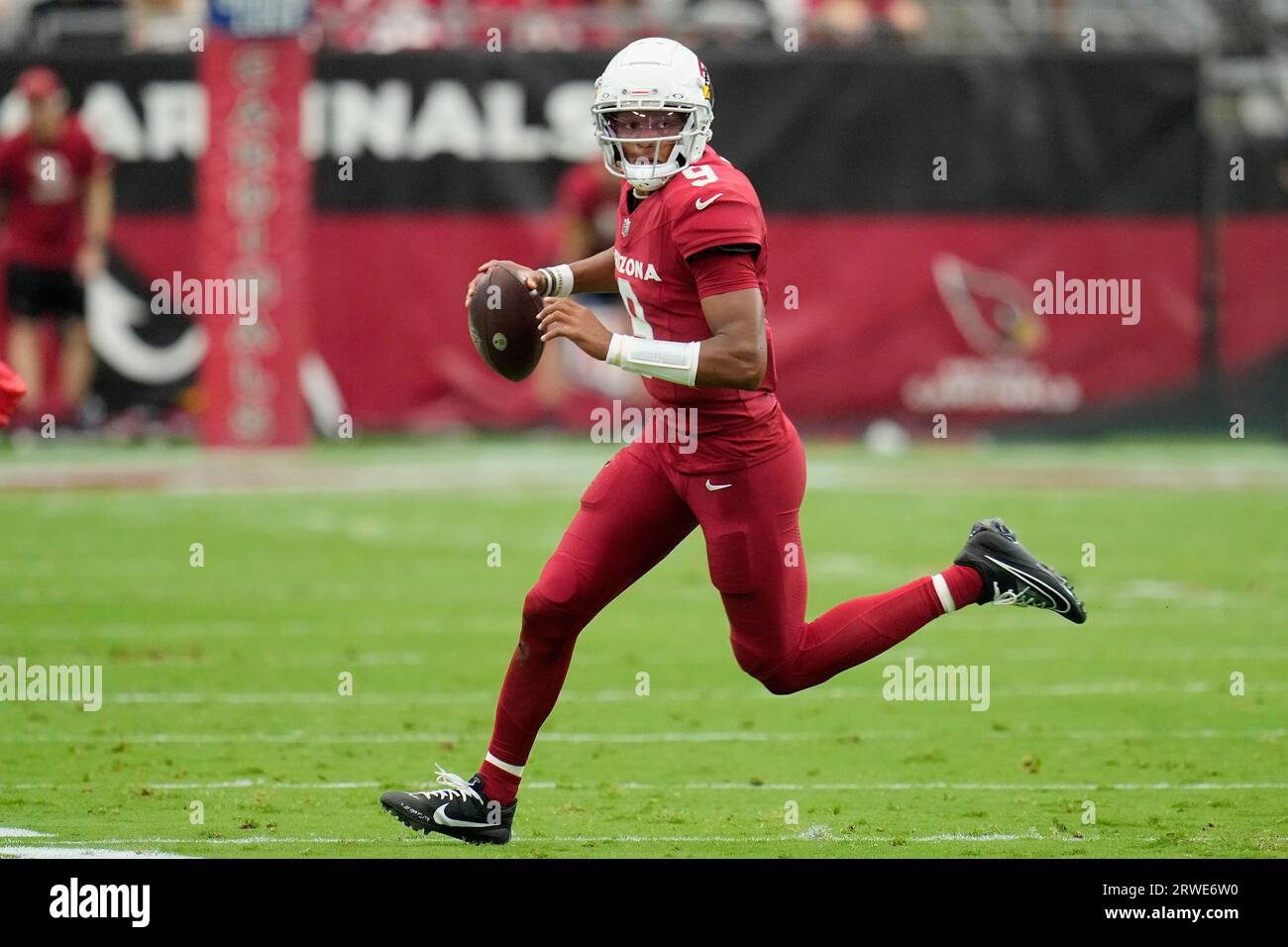 Arizona Cardinals quarterback Joshua Dobbs rolls out to throw the ball ...