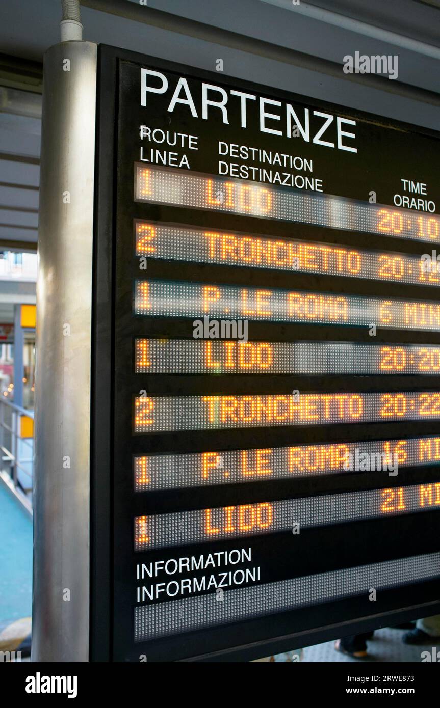 Information board showing Vaporetto water bus departures in Venice, Italy Stock Photo