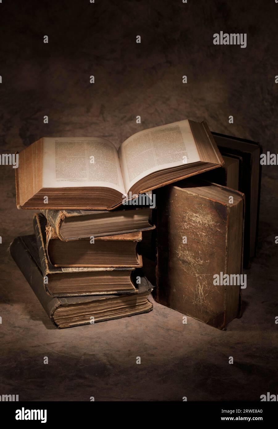Still life of old antique books. The open book is printed in 1866 Stock Photo