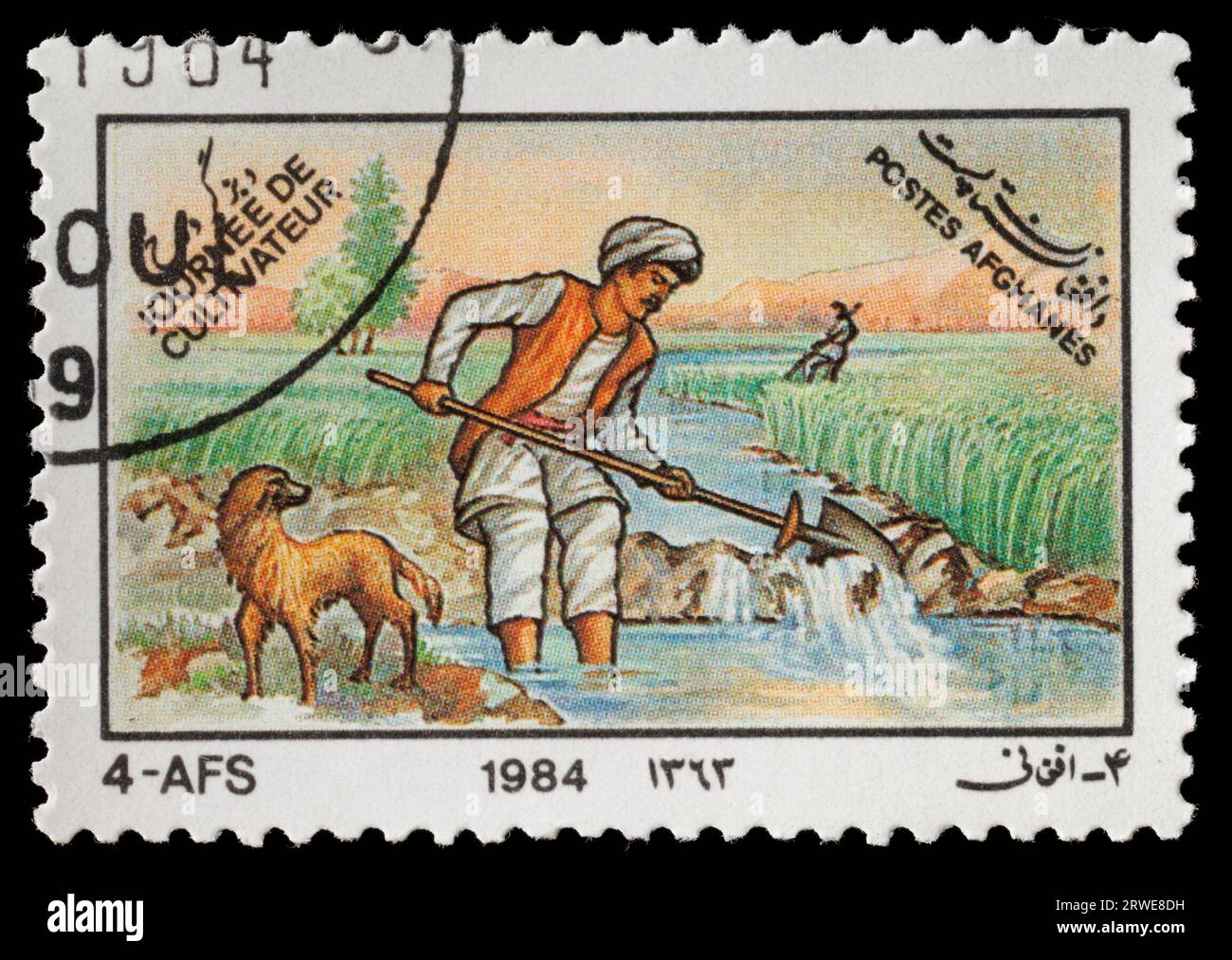 AFGHANISTAN, CIRCA 1984: A Stamp depicting agricultural activities. circa 1984 in Afghanistan Stock Photo