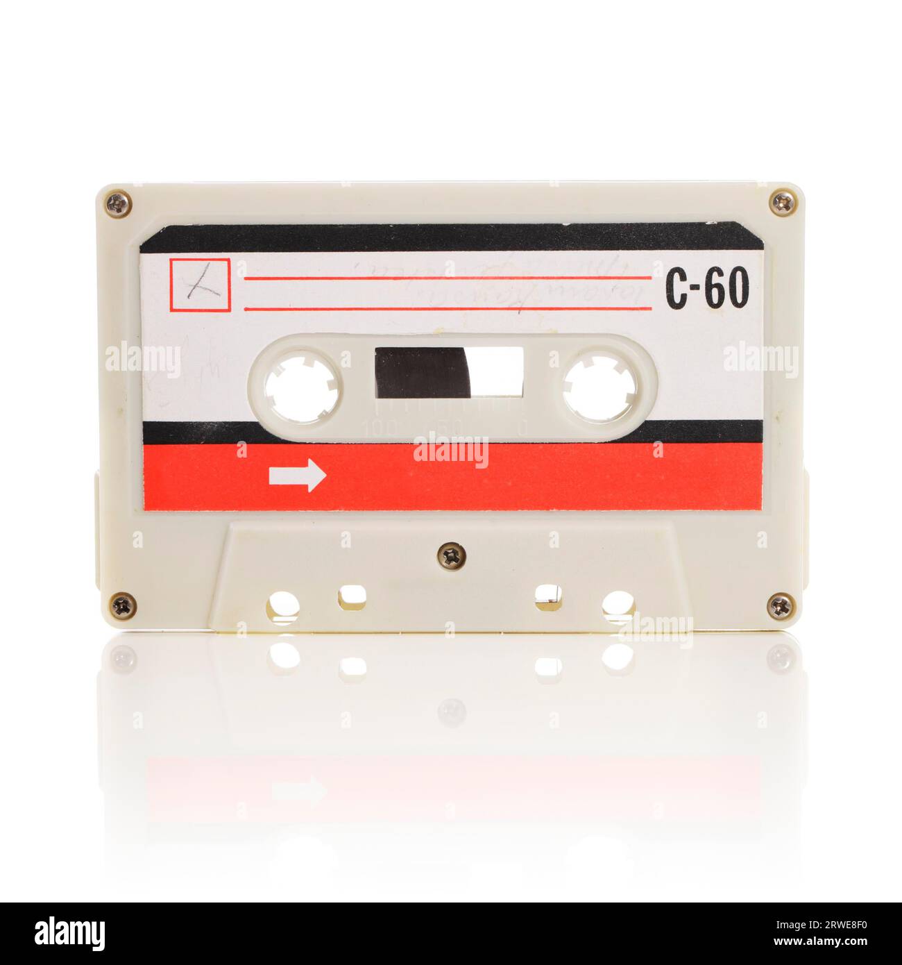 Old compact cassette audio tape isolated on white with natural reflection Stock Photo