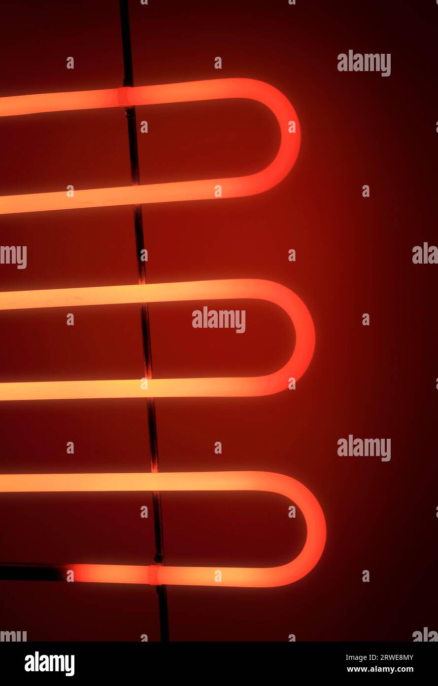 Electrical heating element of an electrical barbeque grill glowing in