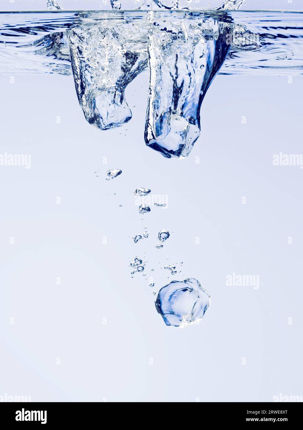 Ice cubes falling in water hi-res stock photography and images - Alamy