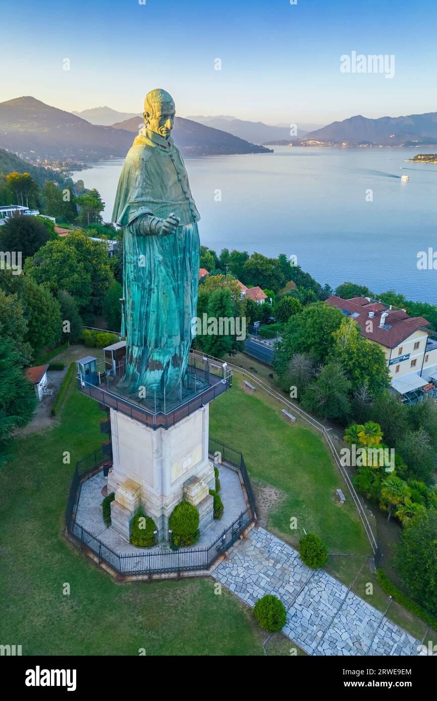 Aerial view of the Statue of San Carlo Borromeo during a summer sunset. Arona, Lake Maggiore, Piedmont, Italy, Europe. Stock Photo