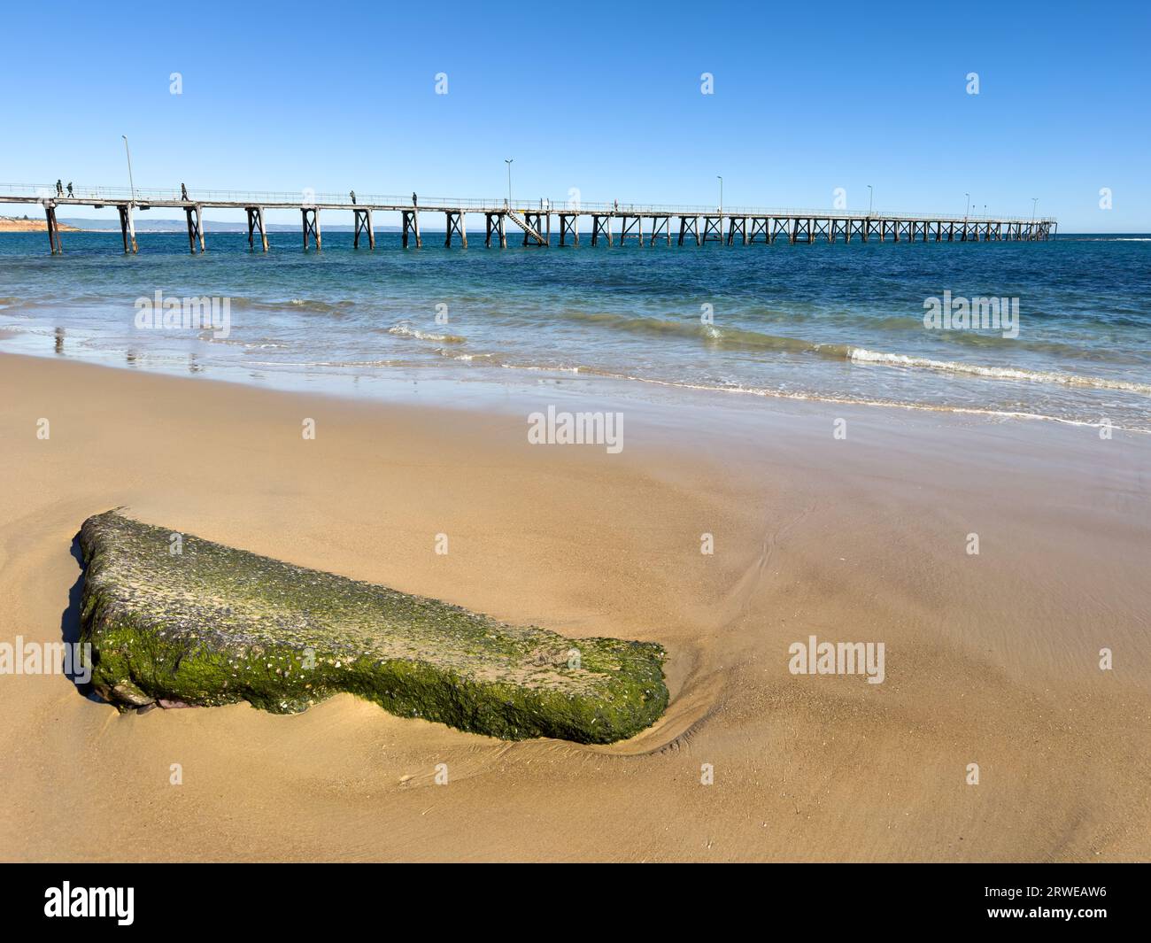 Classic wooden Port Noarlunga Jetty stretches out into the ocean in Adelaide, South Australia Stock Photo