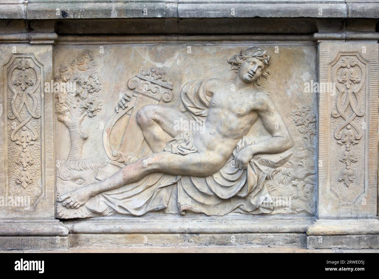 18th century bas-relief of the Apollo (God in Greek mythology) by Johann Heinrich Meissner on the historic tenement house terrace in the Old Town of Stock Photo