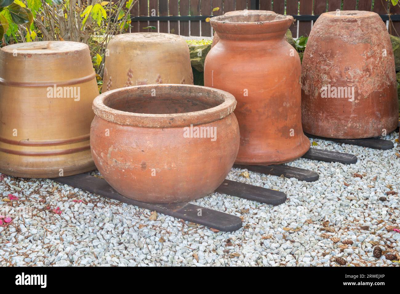Autumn cleanups empty flower pots in the stone garden Stock Photo