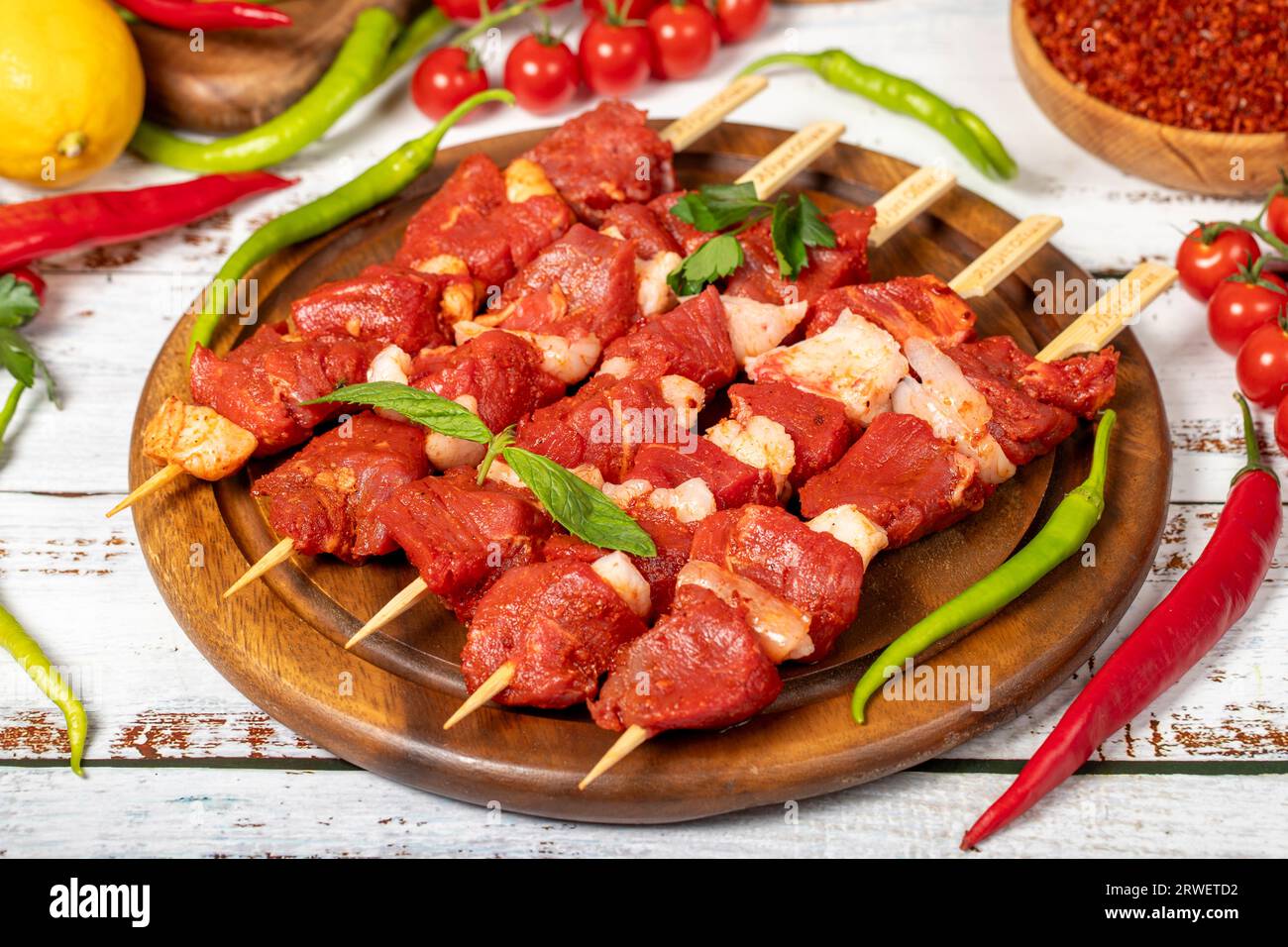 Beef tenderloin skewer on wood background. Beef tenderloin skewer with