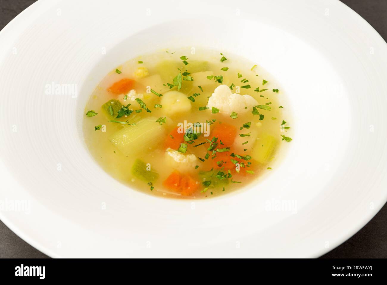 Italian vegetable soup minestrone made with a variety of vegetables Stock Photo