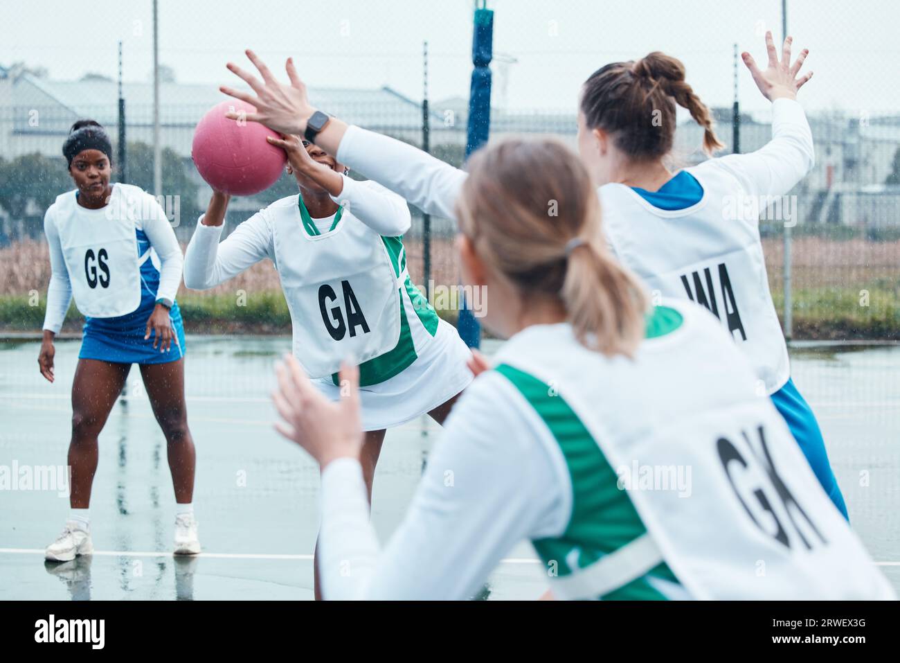 Netball sports team, game ball and women defend, attack and pass in