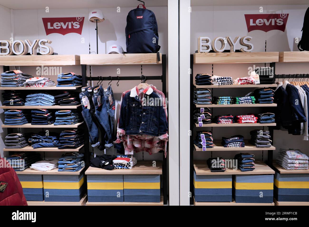 LEVIS BOYS CLOTHING ON DISPLAY INSIDE THE FASHION STORE Stock Photo