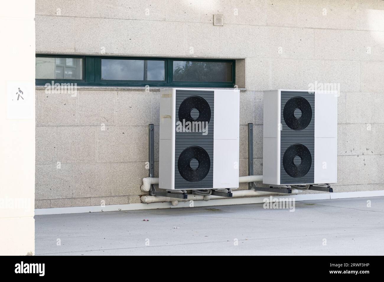 Air conditioner compressor units installed outside of a building Stock