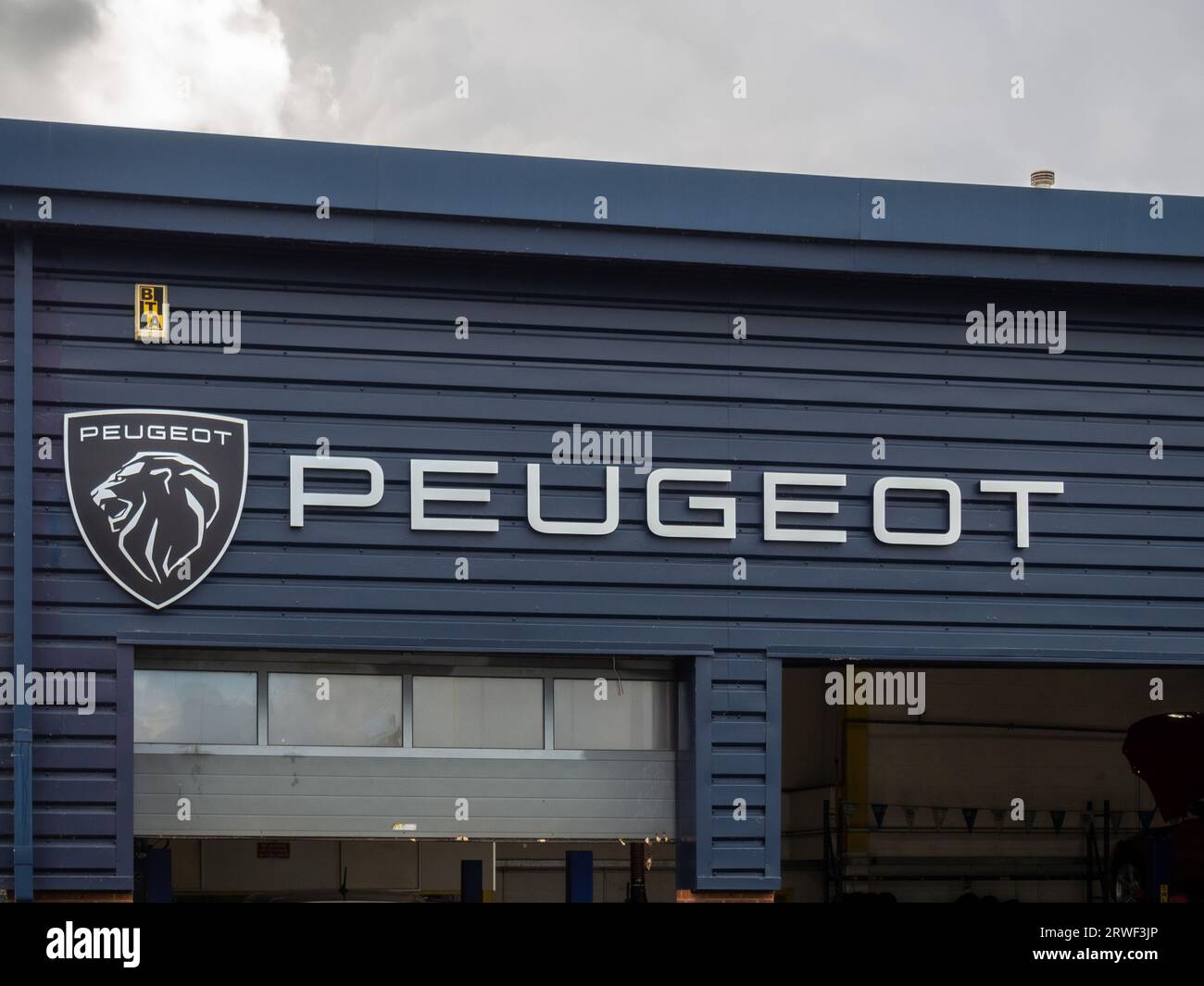 Peugeot cars sign and logo, Bristol Street Motors car dealership