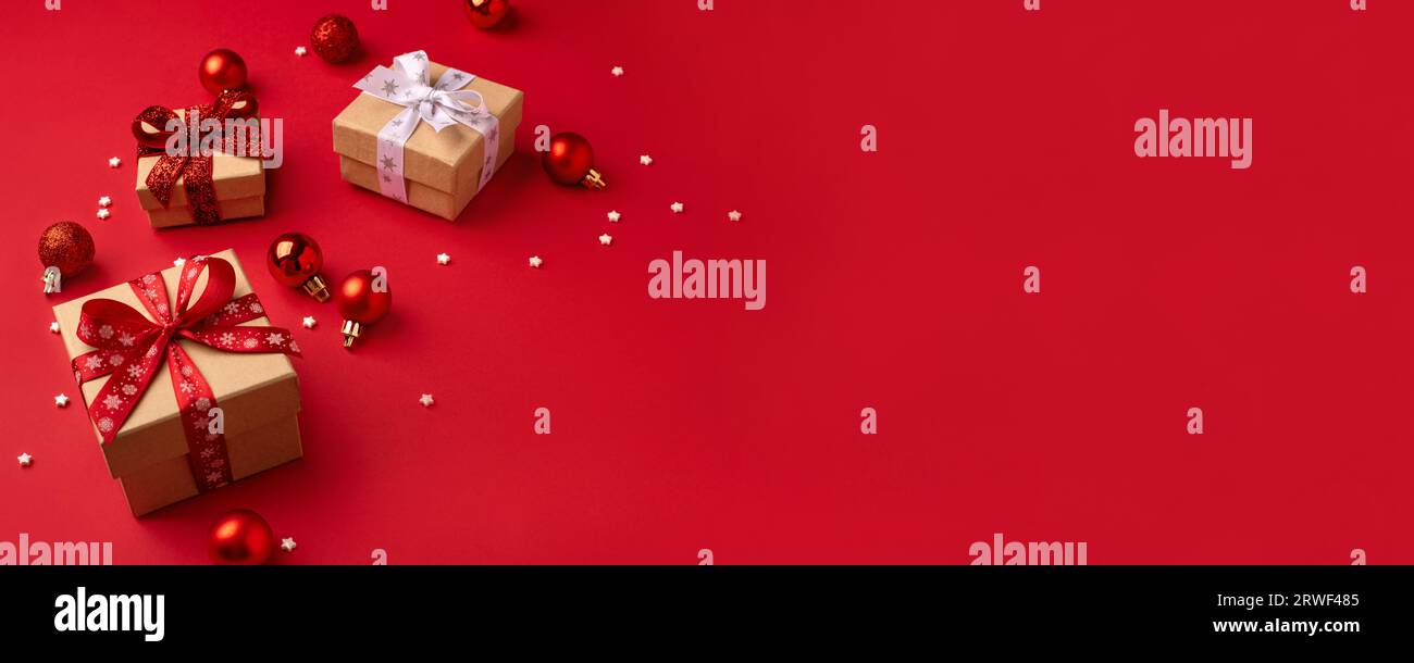 Christmas gift boxes with red balls Stock Photo - Alamy
