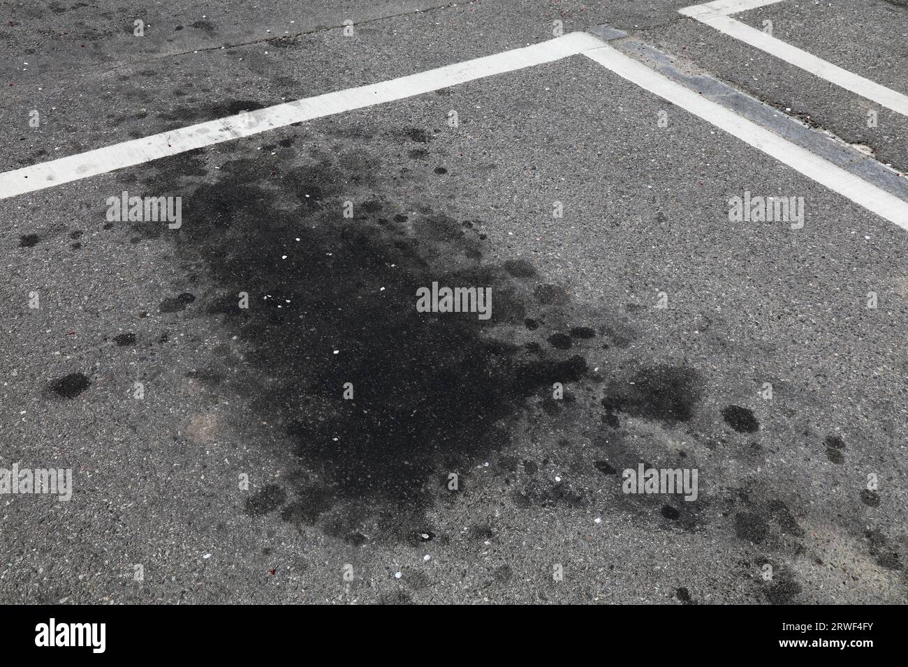 Parking oil stains in South Korea. Ground pollution problem. Oil spots