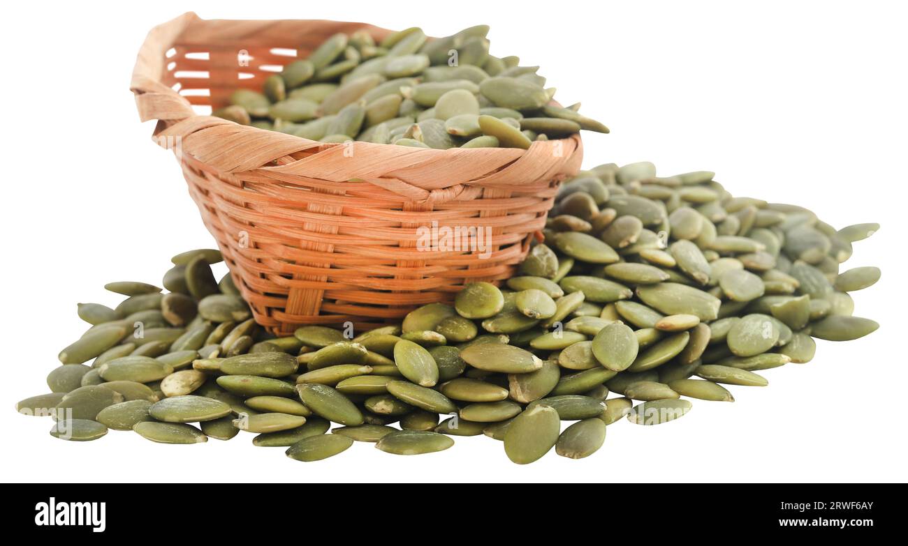 Peeled organic pumpkin seeds in basket Stock Photo