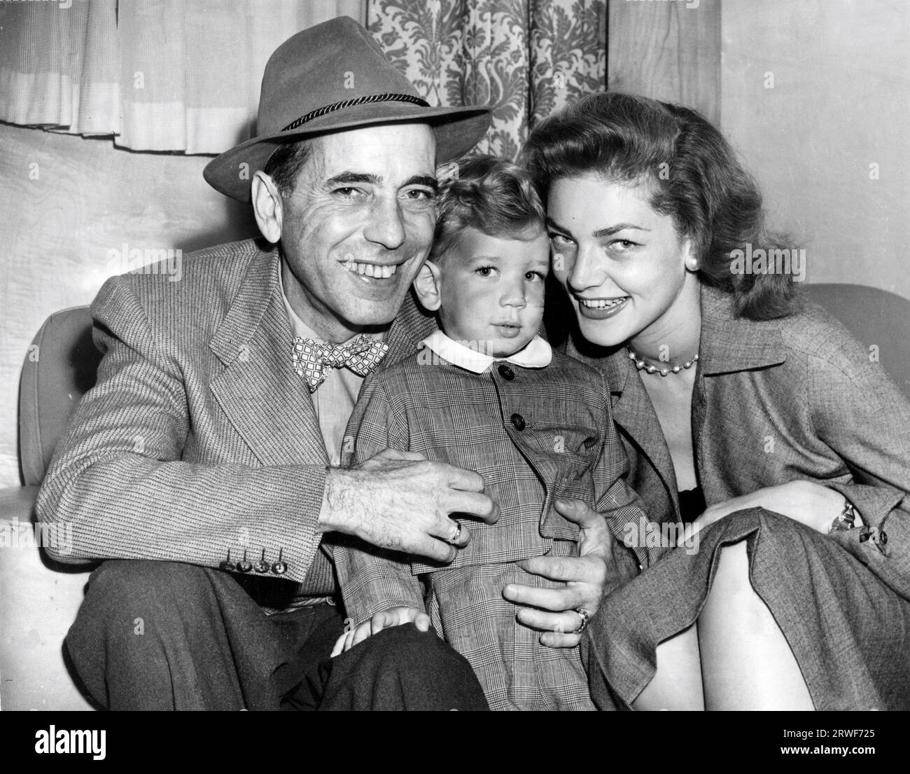 HUMPHREY BOGART and his wife LAUREN BACALL with their son STEPHEN BOGART on board the ocean liner Ile de France on 8th September 1951 just before sailing from Southampton for New York after completion of studio filming of The African Queen at Isleworth Studios in England Stock Photo
