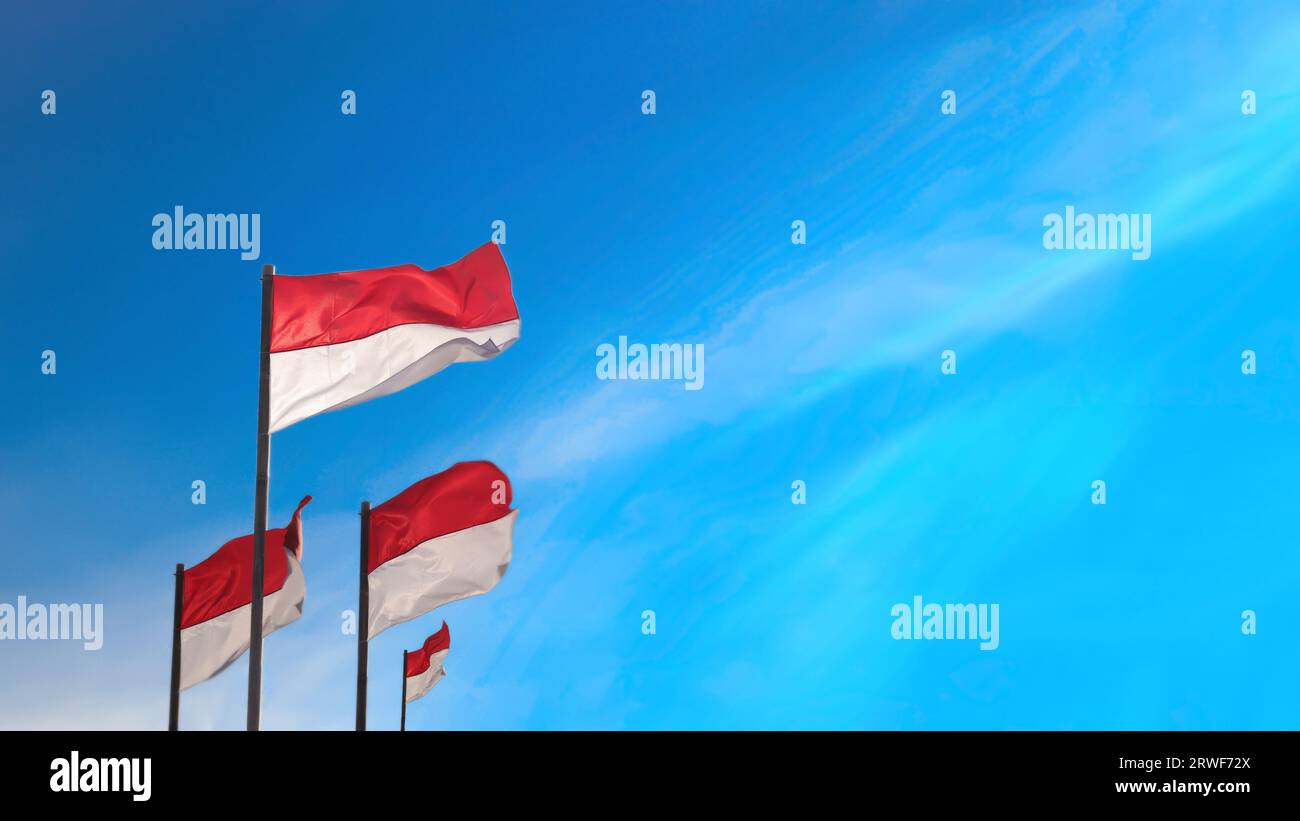 17 August 1945, Indonesian flags against sky background. Independence day concept Stock Photo