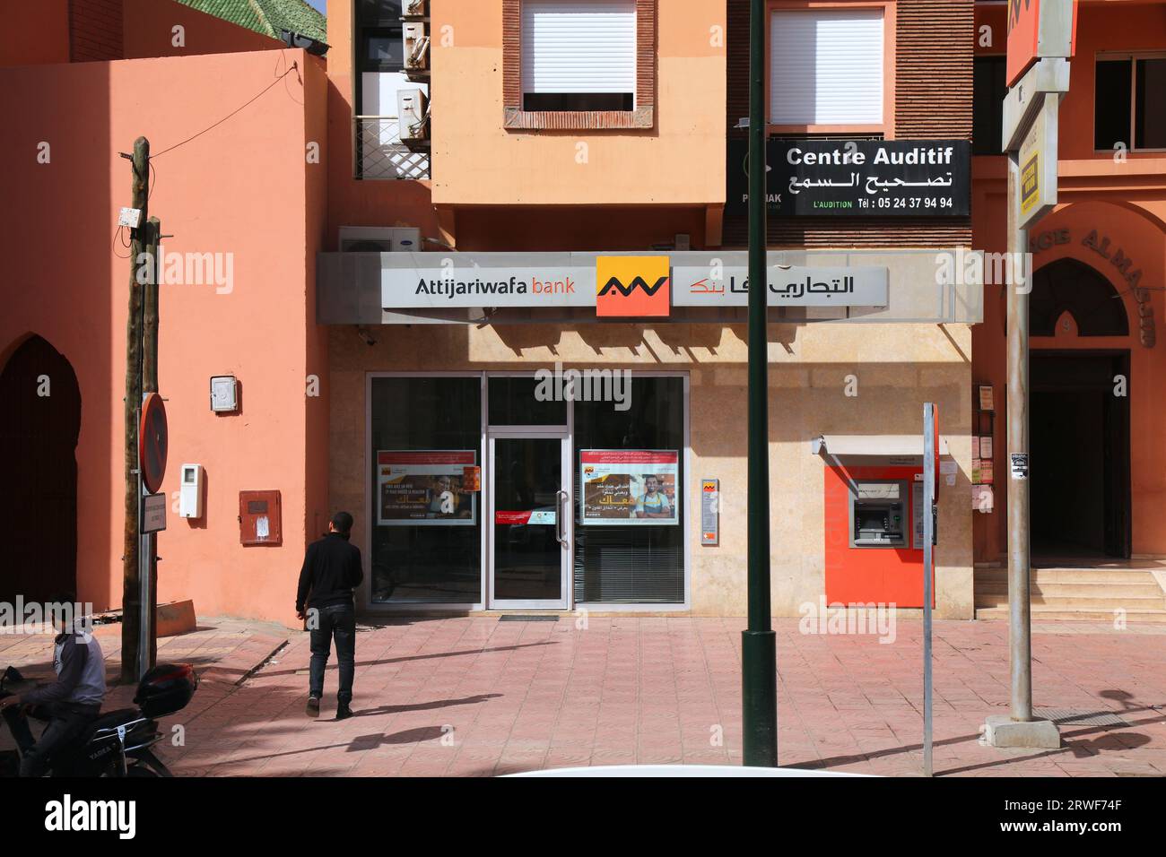 MARRAKECH, MOROCCO - FEBRUARY 21, 2022: People visit Attijariwafa Bank branch in Marrakech, Morocco. Attijariwafa Bank is a multinational Moroccan ban Stock Photo