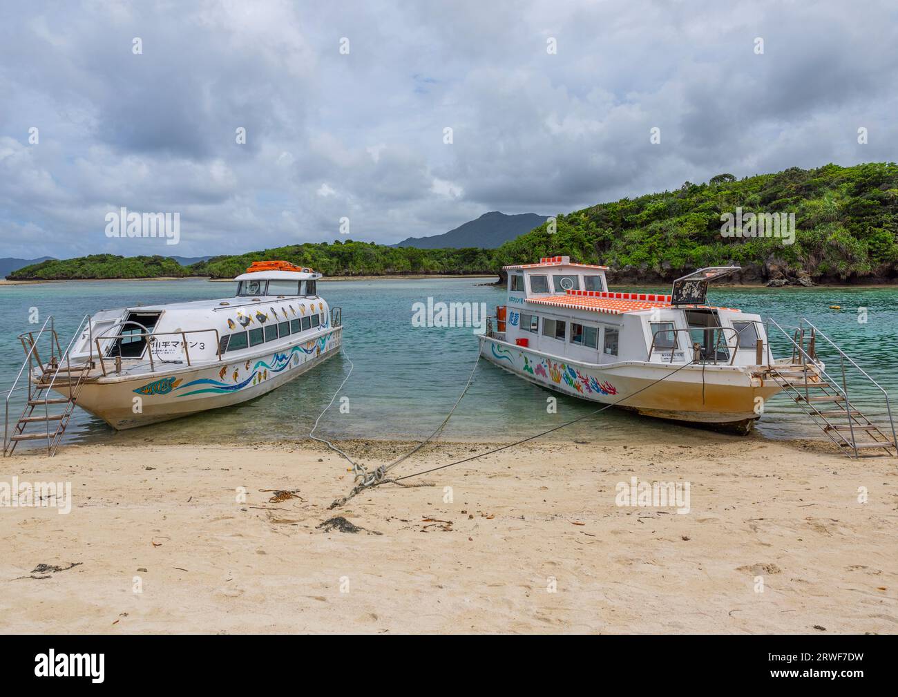 Glass bottom boats in tropical lagoon in Kabira bay, Yaeyama Islands, Ishigaki, Japan Stock Photo