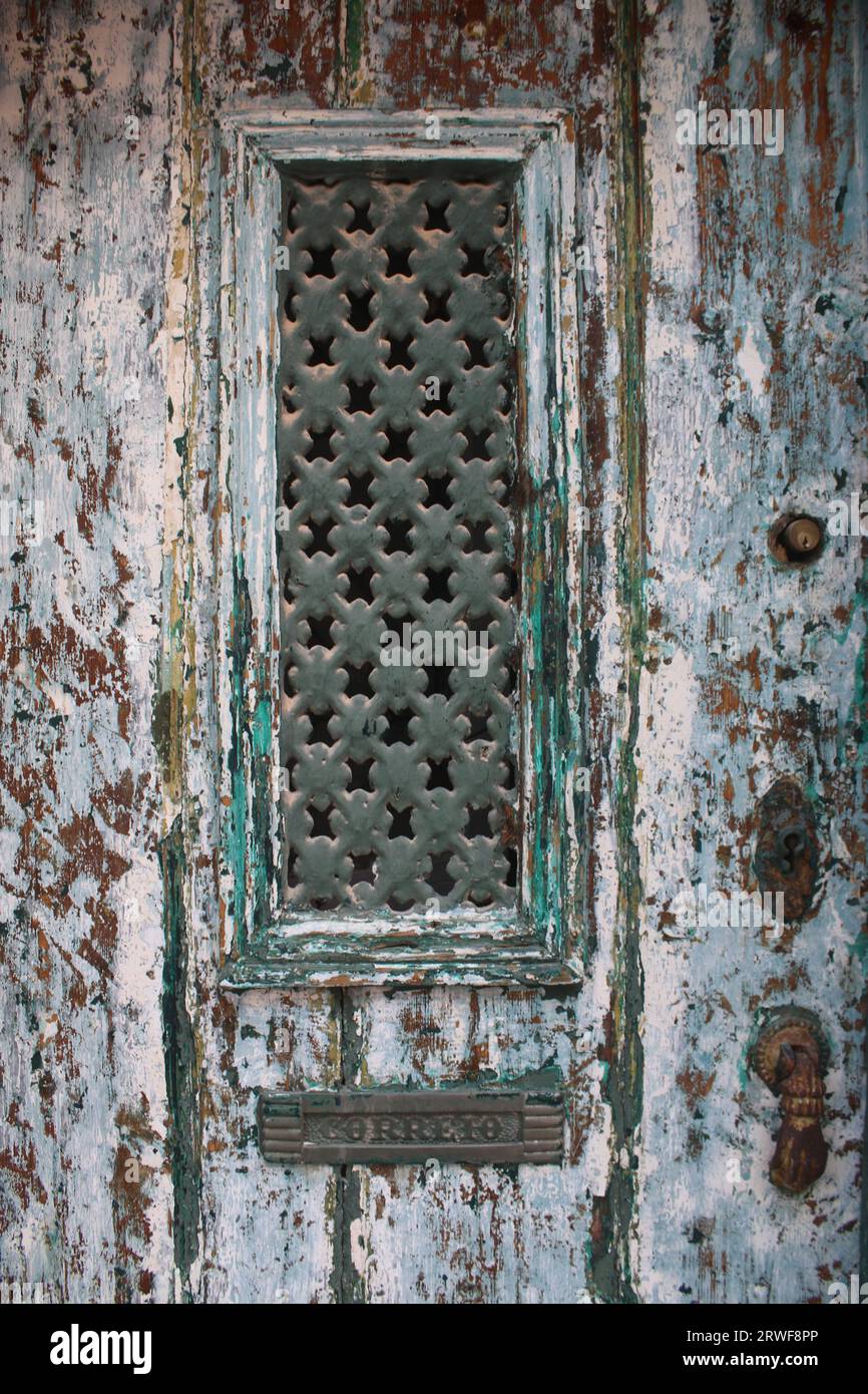 A Vintage looking Front Door with Distressed Paintwork. Stock Photo
