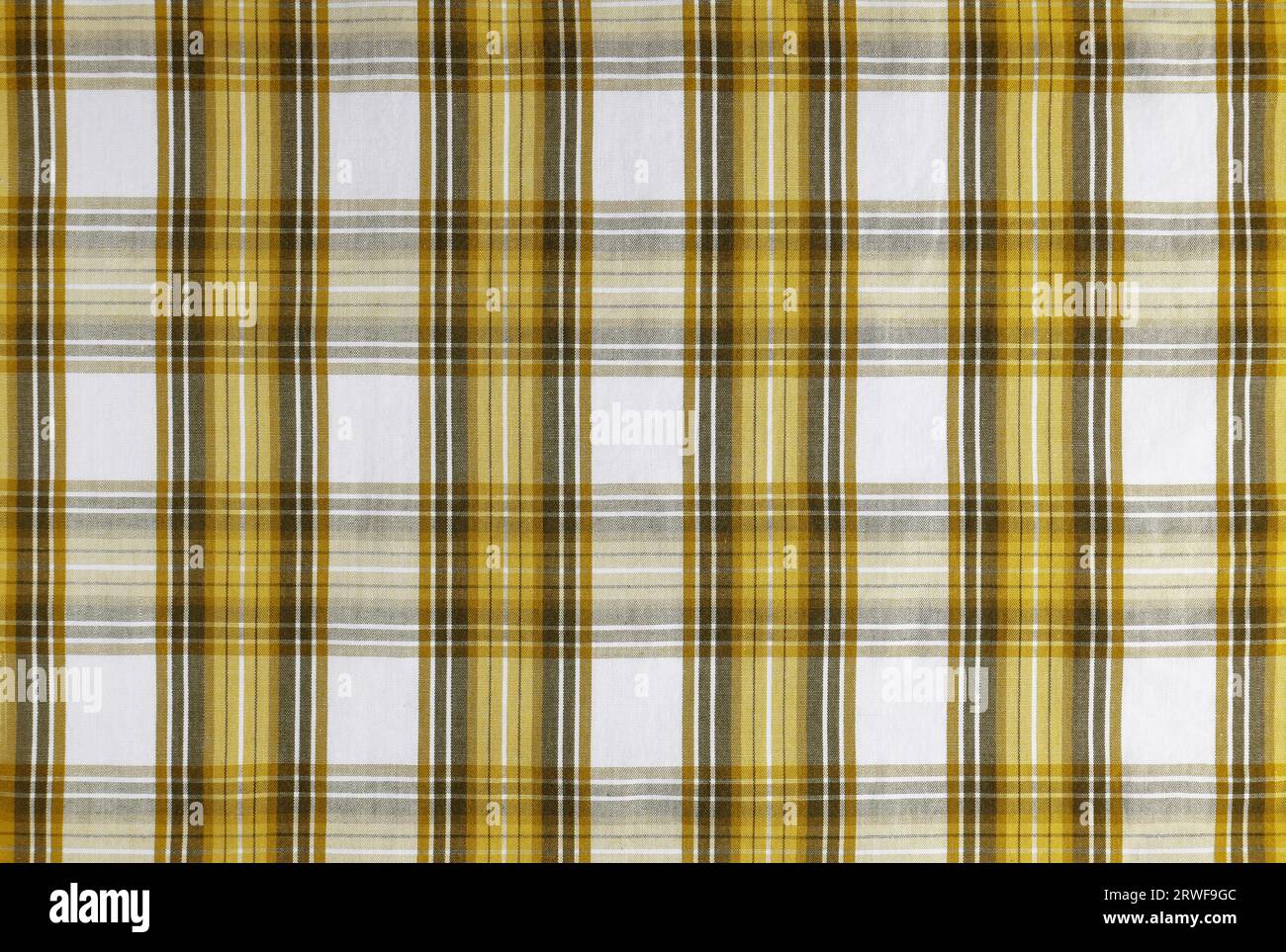 Yellow checkered texture fabric, tartan pattern. Shirt fabric, tablecloth textile, linen plaid cloth, classic scottish check pattern. Backdrop, wallpa Stock Photo