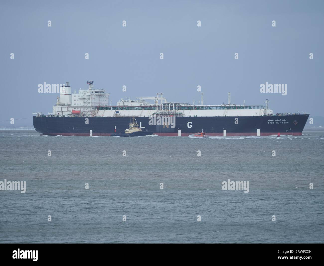 Sheerness, Kent, UK. 19th Sep, 2023. UK Weather: windy in Sheerness, Kent. Huge gas ship Cheikh el Mokrani is assisted by two Svitzer tugs (with a third on standby) as it departs Sheerness and has to navigate past WW2 ammunition shipwreck SS Richard Montgomery. Credit: James Bell/Alamy Live News Stock Photo