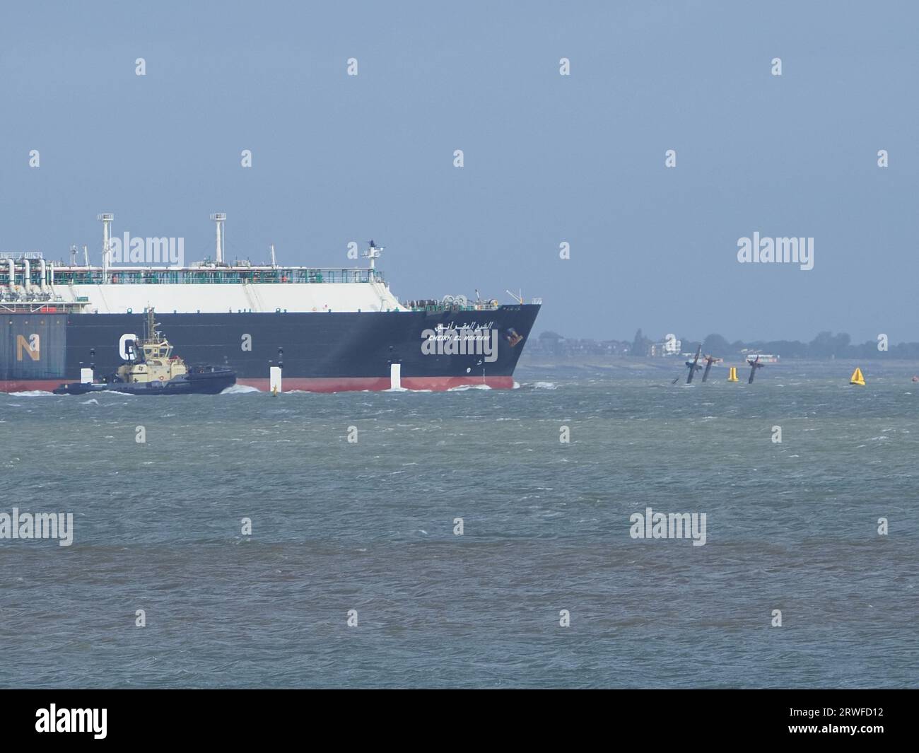 Sheerness, Kent, UK. 19th Sep, 2023. UK Weather: windy in Sheerness, Kent. Huge gas ship Cheikh el Mokrani is assisted by two Svitzer tugs (with a third on standby) as it departs Sheerness and has to navigate past WW2 ammunition shipwreck SS Richard Montgomery. Credit: James Bell/Alamy Live News Stock Photo